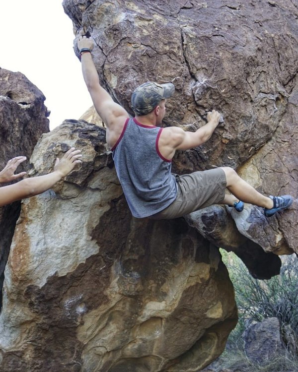 Brian bouldering on a sandstone block